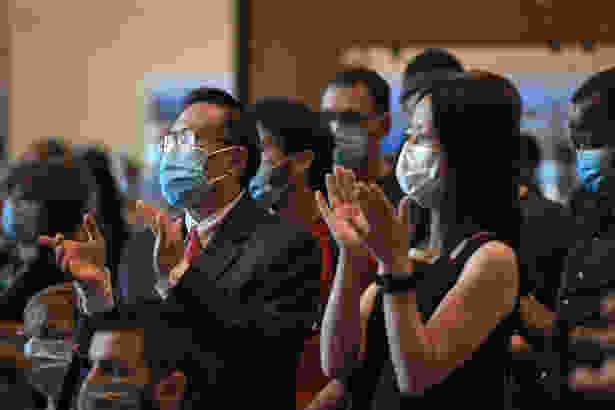 Guangping Gao, PhD, and Zhiping Weng, PhD, applaud the announcement of the gift.